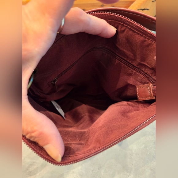 Small burgundy cross body purse with several zipper pockets. - Picture 3 of 7